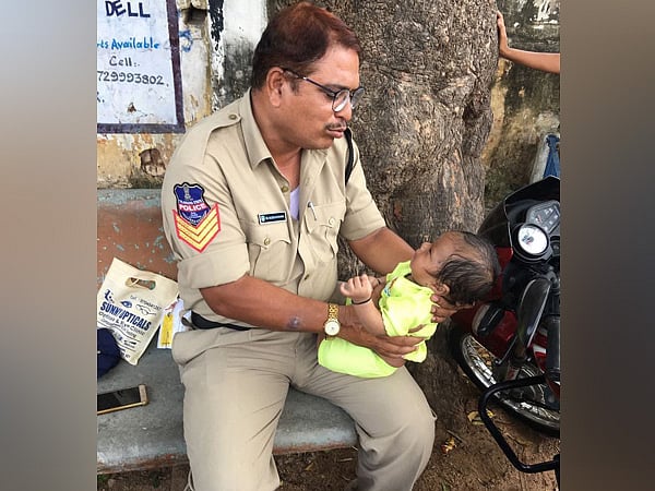 Telangana Police Babysits Infant While Mother Takes Exam