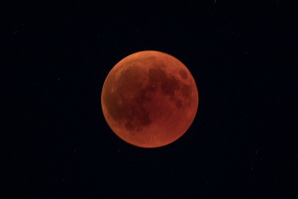 'Blood moon' Dazzles Skygazers In Century's Longest Eclipse