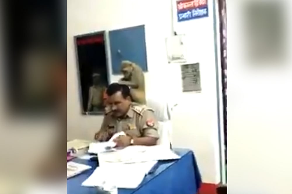 This UP Police Officer Gets Free Hair Treatment From A Monkey