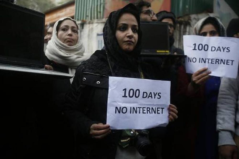 Kashmiri journalists hold placards and protest against Internet shutdown in Kashmir