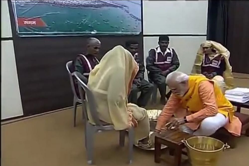 PM Modi Washes Feet Of Sanitation Workers At Kumbh