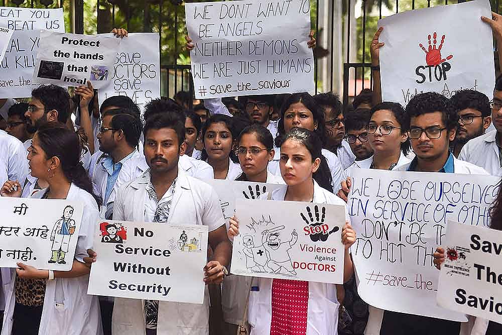 Doctors from J.J. Hospital during a protest to show solidarity with their counterparts in West Bengal, who stopped work on Tuesday protesting against the assault on their colleagues, in Mumbai. (PTI photo)
