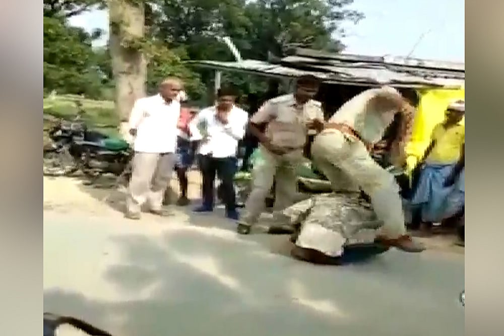 UP Policemen Caught On Camera Assaulting Young Man, Suspended