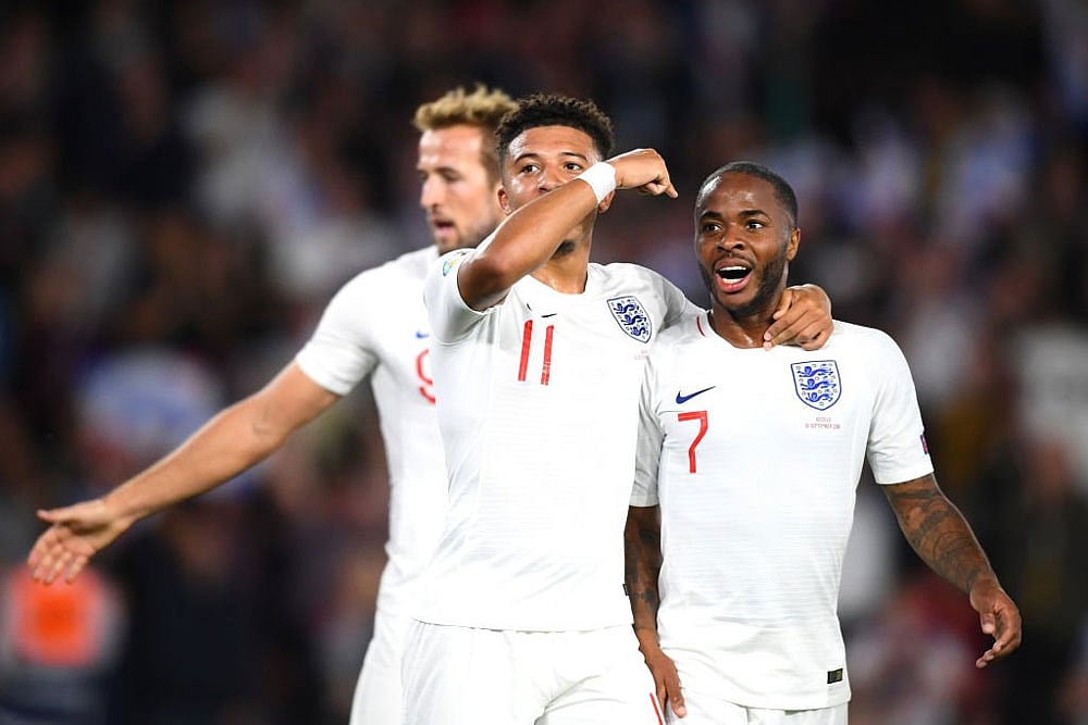 Raheem Sterling with his England national football teammates.
