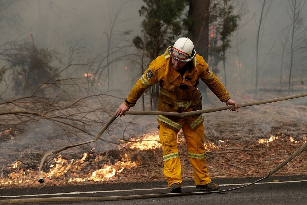 Australia Firefighters Race To Contain Blazes As Heatwave Looms