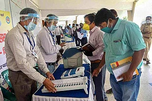 Election officers demonstrate the Electronic Voting Machine (EVM) and Voter-Verified Paper Audit Trail (VVPAT) during a training programme ahead of the assembly poll, at S.K.M hall in Patna.