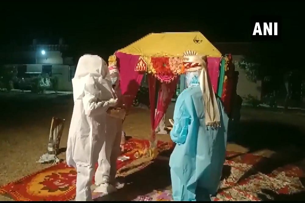 Watch: Rajasthan Couple Ties Knot In PPE Suit After Bride Tests Covid-19 Positive