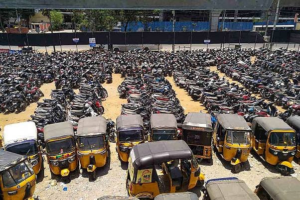 Auto-rickshaws are seen parked during a nationwide lockdown in the wake of coronavirus pandemic, at Moinabad in Ranga Reddy district.