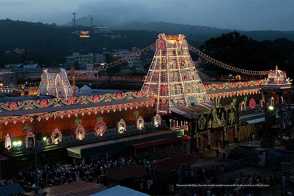 Tirupati temple lit up at night.