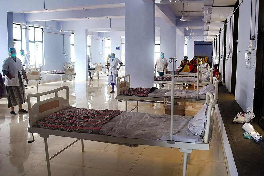 Beds lined at businessman Kadar Shaikhs office, converted into a COVID Care Centre for free treatment of the needy, in Surat.