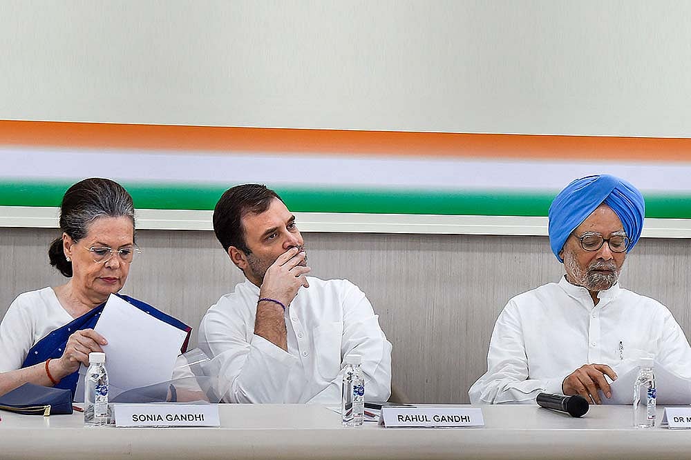 Congress President Sonia Gandhi flanked by senior party leaders Rahul Gandhi and Manmohan Singh during Congress Working Committee (CWC) meeting, at AICC HQ in New Delhi.