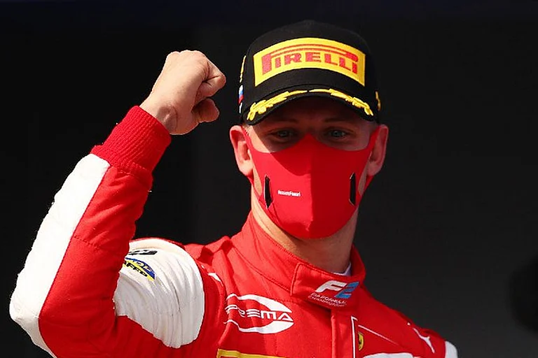 The 23-year-old joined Ferrari's young driver program in 2019 and competed in Formula Two for two seasons. - null