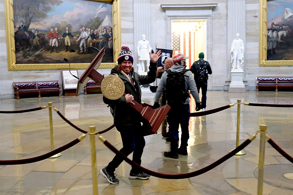 US Capitol Violence: Cops Arrest Man Photographed With Speaker Pelosi’s Lectern