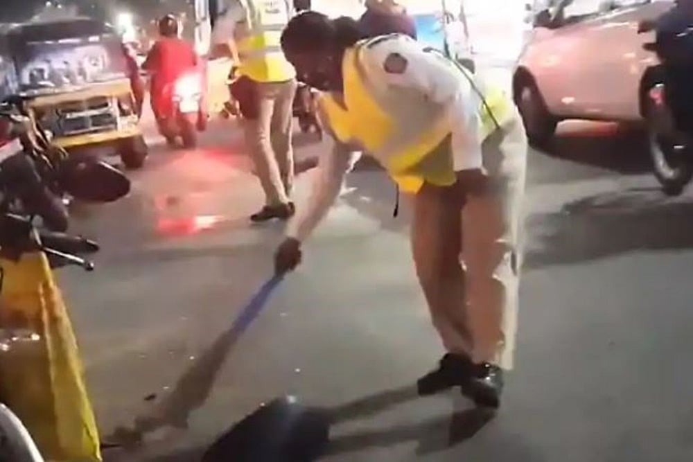 Video Of Woman Cop Sweeping Road To Remove Broken Glass Pieces Goes Viral