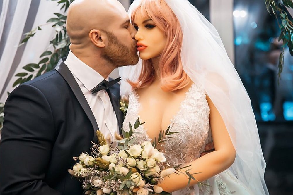 Kazakh Bodybuilder Yurii Tolochko 'Marries', Then 'Divorces' Sex Doll, Finds New Sex Doll As 'Wife'