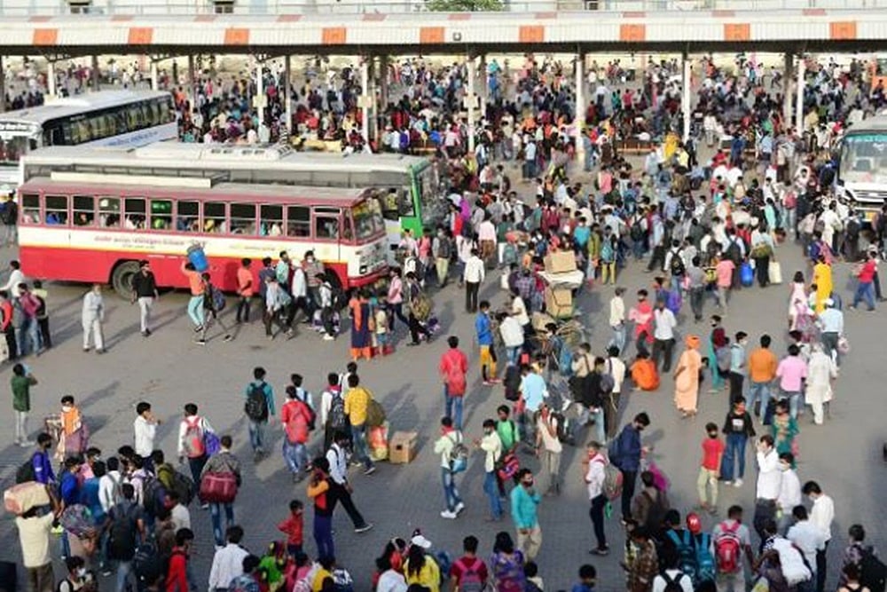In Pics: Migrants Rush Home As Delhi Enters Lockdown, Massive Crowds At Bus Stands