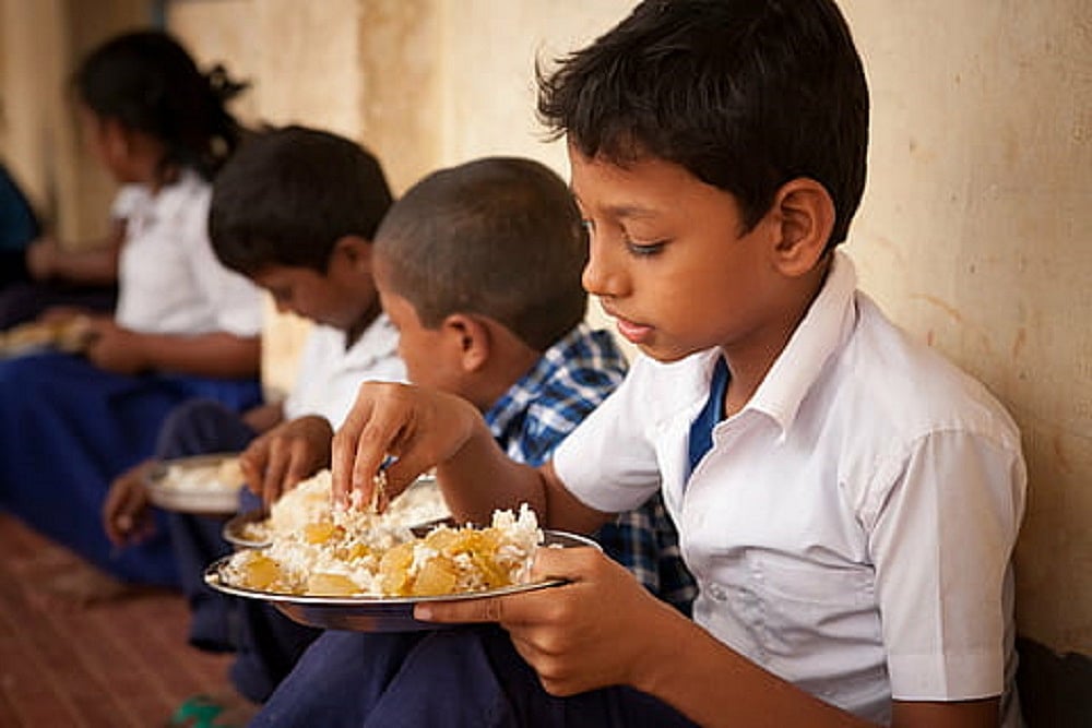 Indian children eating MId-day meals at schools