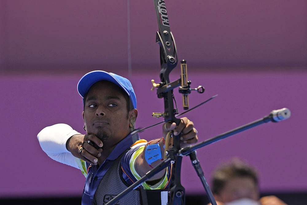 Indias Atanu Das, right, shoots an arrow during his individual eliminations match against South Koreas Oh Jinhyek at the 2020 Summer Olympics, Thursday, July 29, 2021, in Tokyo, Japan.