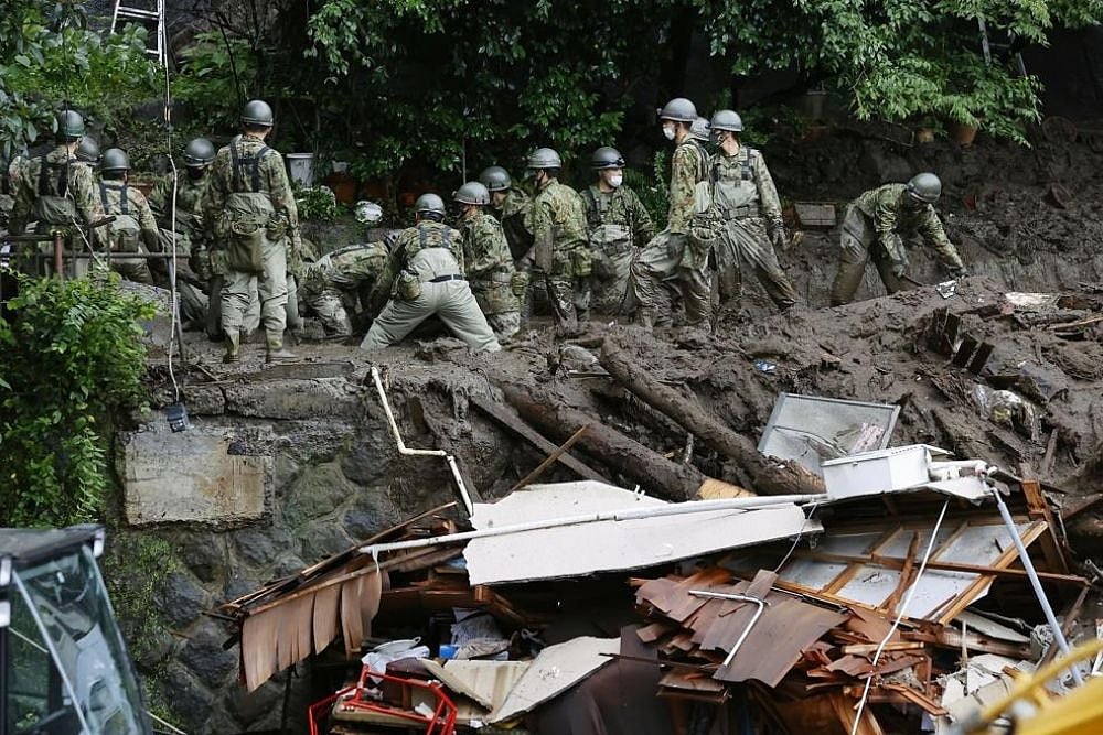 Japan: Rescue Workers Search For Dozens Of Missing In Resort Town Mudslide
