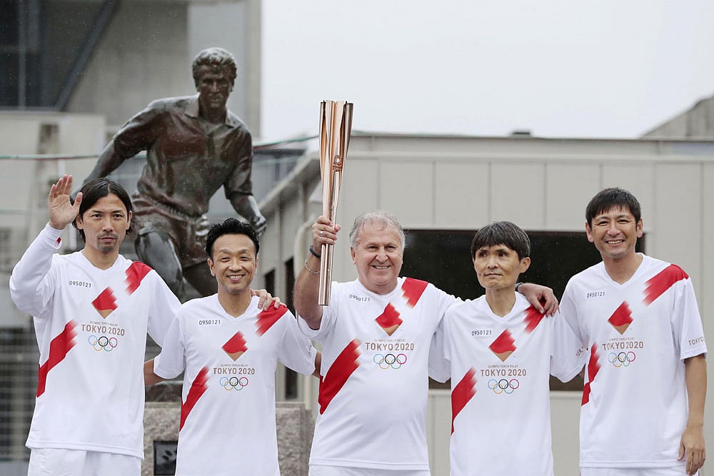 Brazilian Football Legend Zico Runs Olympic Torch Relay In Japan - In Pics