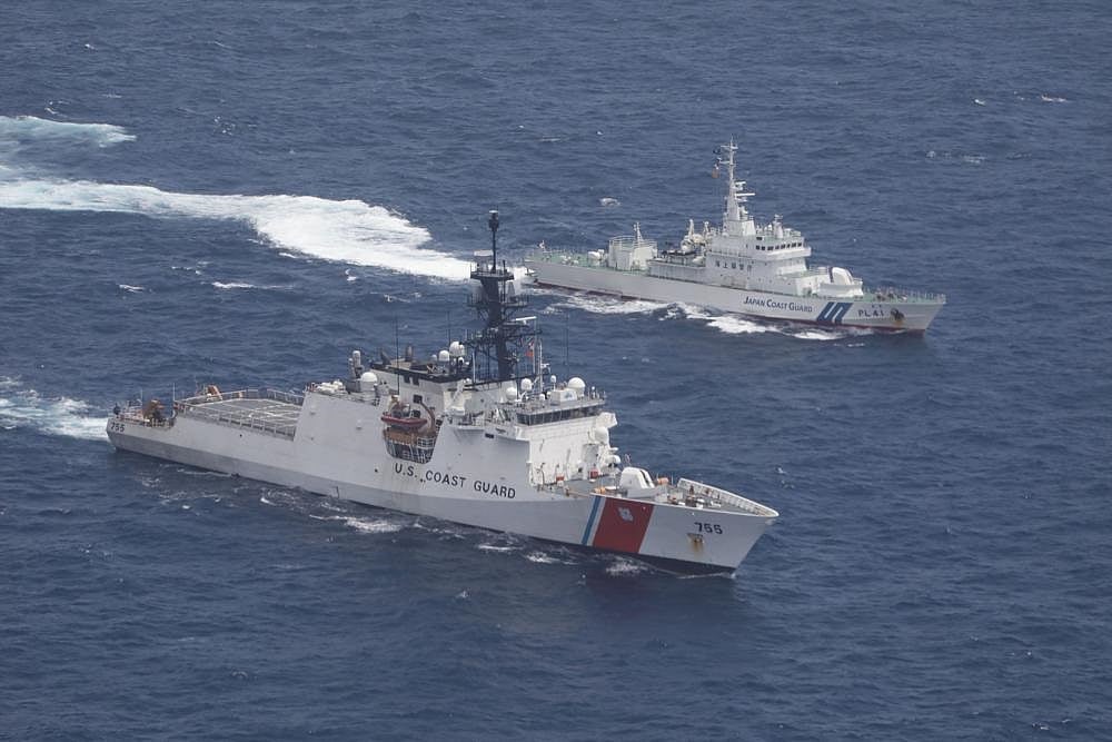US Coast Guard cutter Munro (bottom) and Japan Coast Guard patrol vessel Large Aso transit together in formation during a maritime engagement in the East China Sea on Aug. 25, 2021