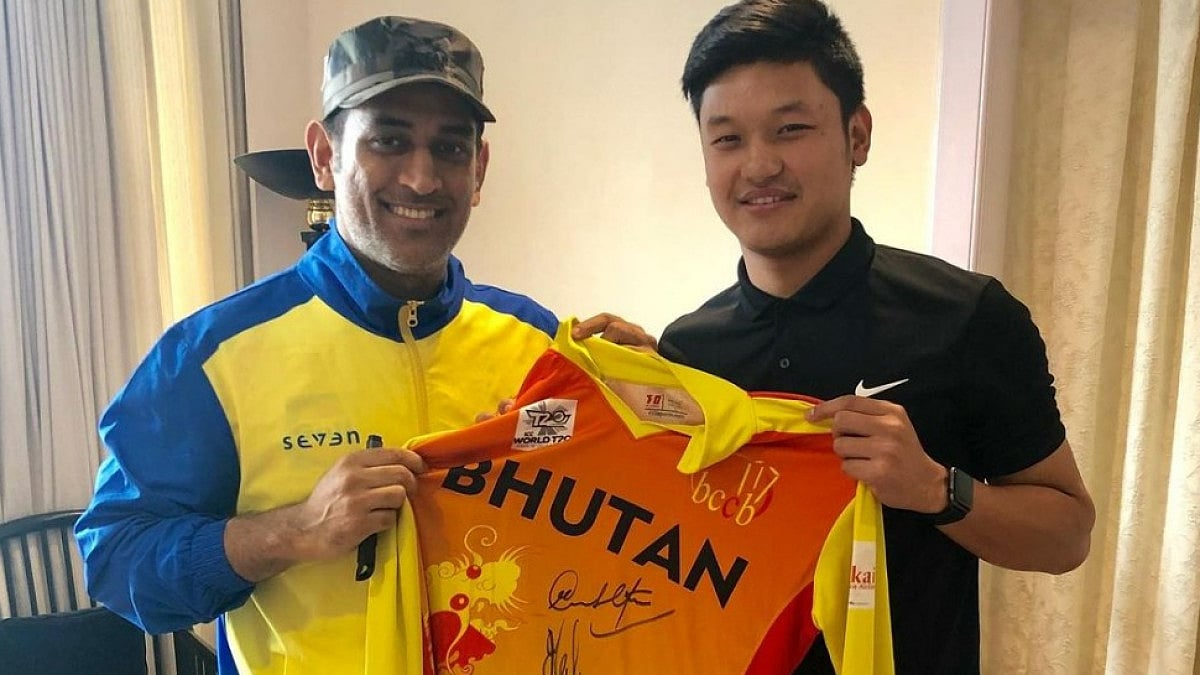 Ranjung Mikyo Dorji (R) poses for a picture with Mahendra Singh Dhoni. 