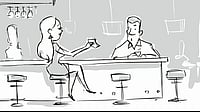A woman goes to drink at a bar