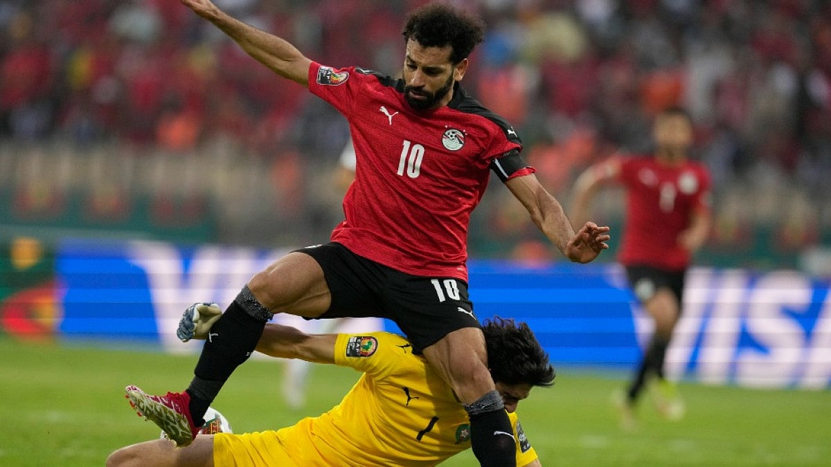 Egypt's Mohamed Salah (in red) collides with Morocco's goalkeeper Yassine Bounou in AFCON 2021. 