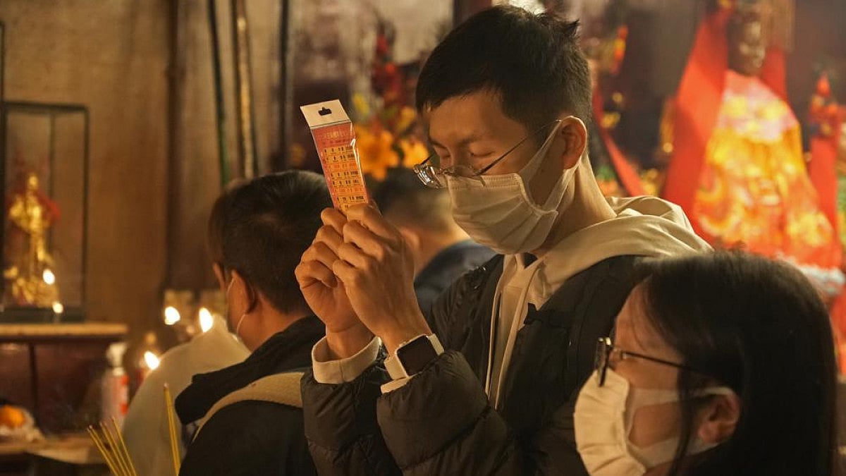 Worshippers pray during the lunar New Year celebrations at the Man Mo temple in Hong Kong.