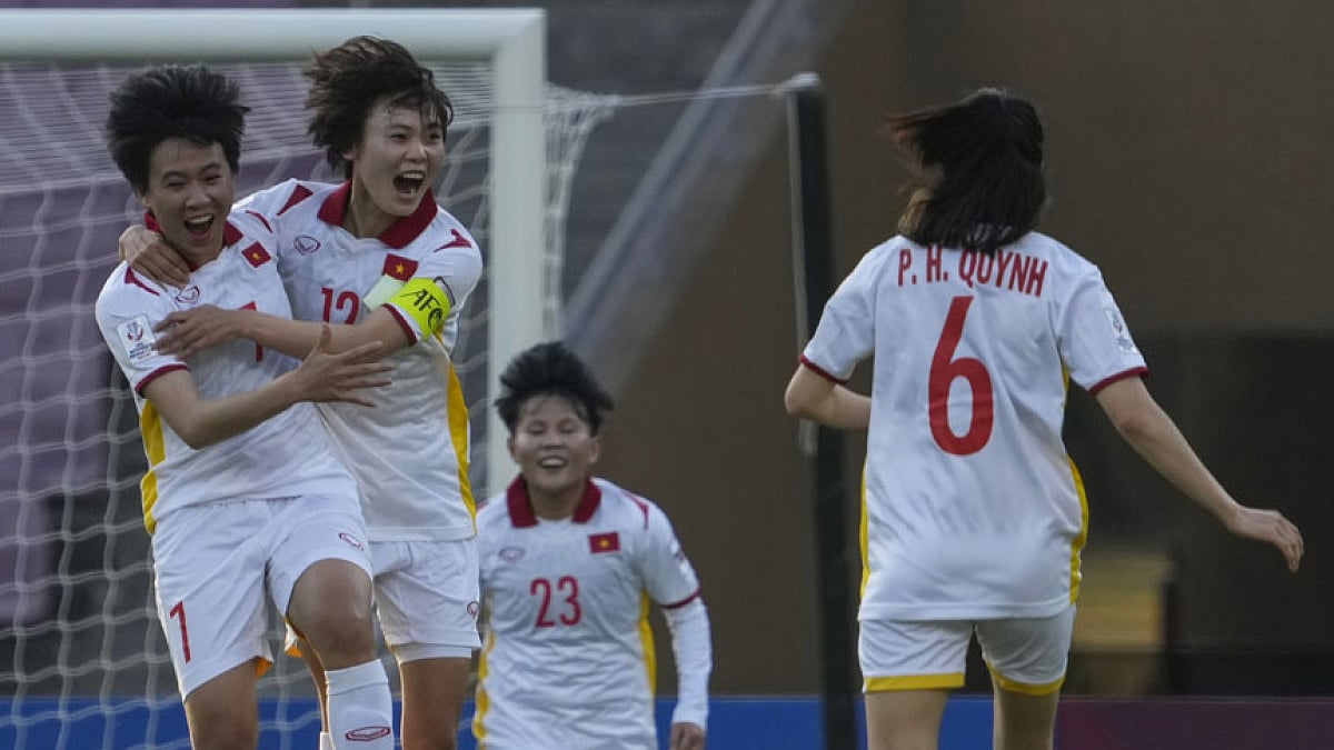 Vietnam players celebrate a goal against China during their AFC Women's Asian Cup 2022 match.
