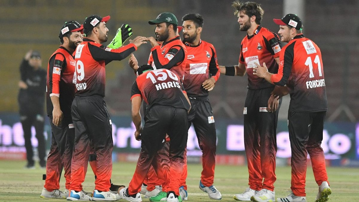 Lahore Qalandars players celebrate the fall of a Peshawar Zalmi wicket in PSL 2022. 