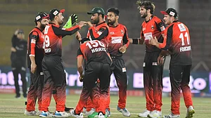 Lahore Qalandars players celebrate the fall of a Peshawar Zalmi wicket in PSL 2022.