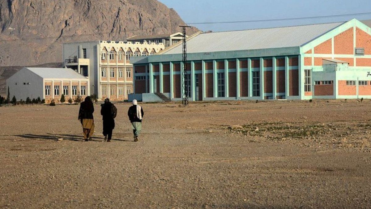 Female students walk on the courtyard of Kandahar University for the first time since the Taliban takeover