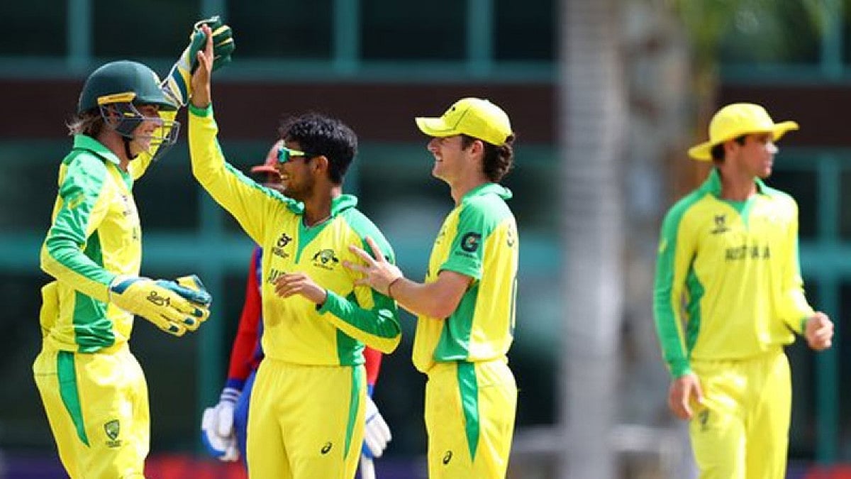 Australian U-19 cricketers celebrate the fall of an Afghanistan U-19 wicket.