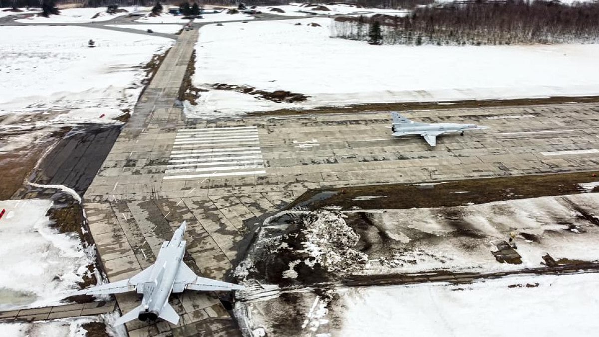 A pair of Tu-22M3 bombers of the Russian air force taxi before takeoff at an air base in Russia. 