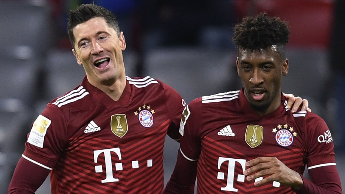 Bayern Munich's Robert Lewandowski, left, celebrates with Kingsley Coman.