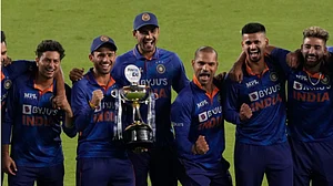 Indian players celebrate with the winners trophy after their series win over West Indies on Friday.