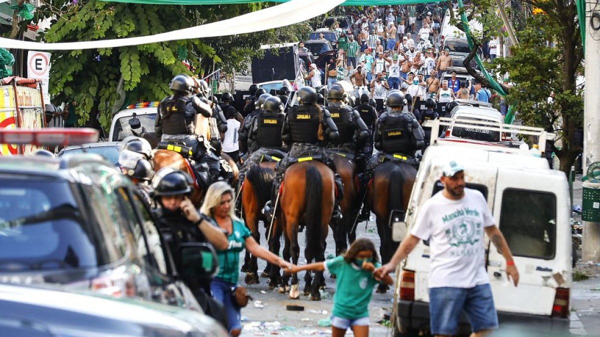 Riot police arrive to disperse Palmeiras soccer club fans in Sao Paulo, Brazil on Feb. 12, 2022.