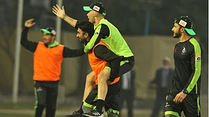 Lahore Qalandars players share a light moment during a training session.