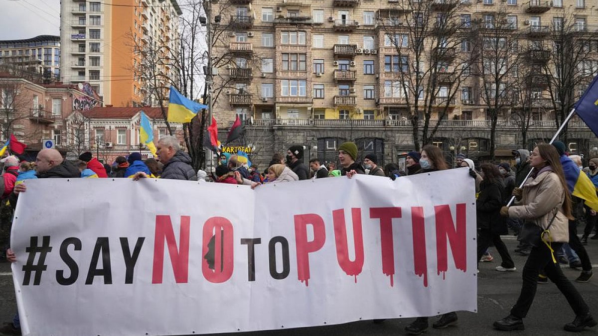 Ukrainians attend a rally in central Kyiv, Ukraine, Saturday, Feb. 12, 2022