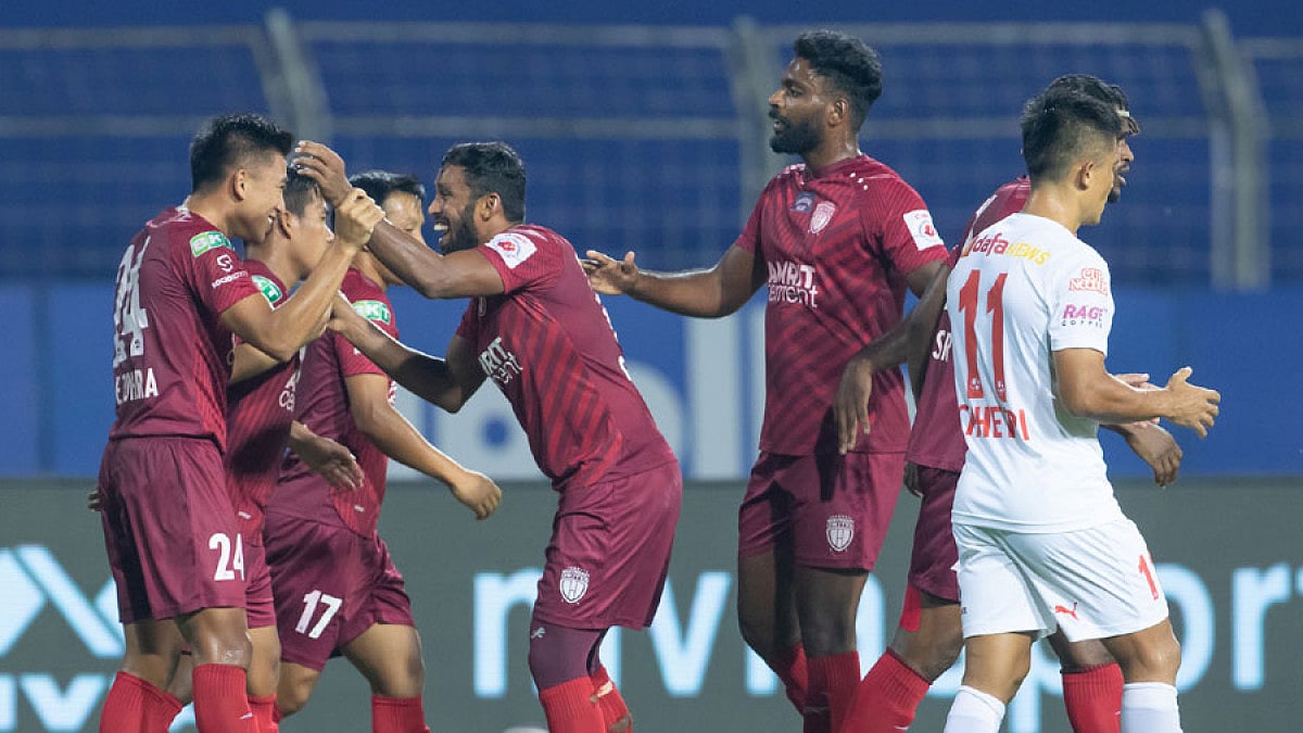 NorthEast United players celebrate a goal against Bengaluru FC.