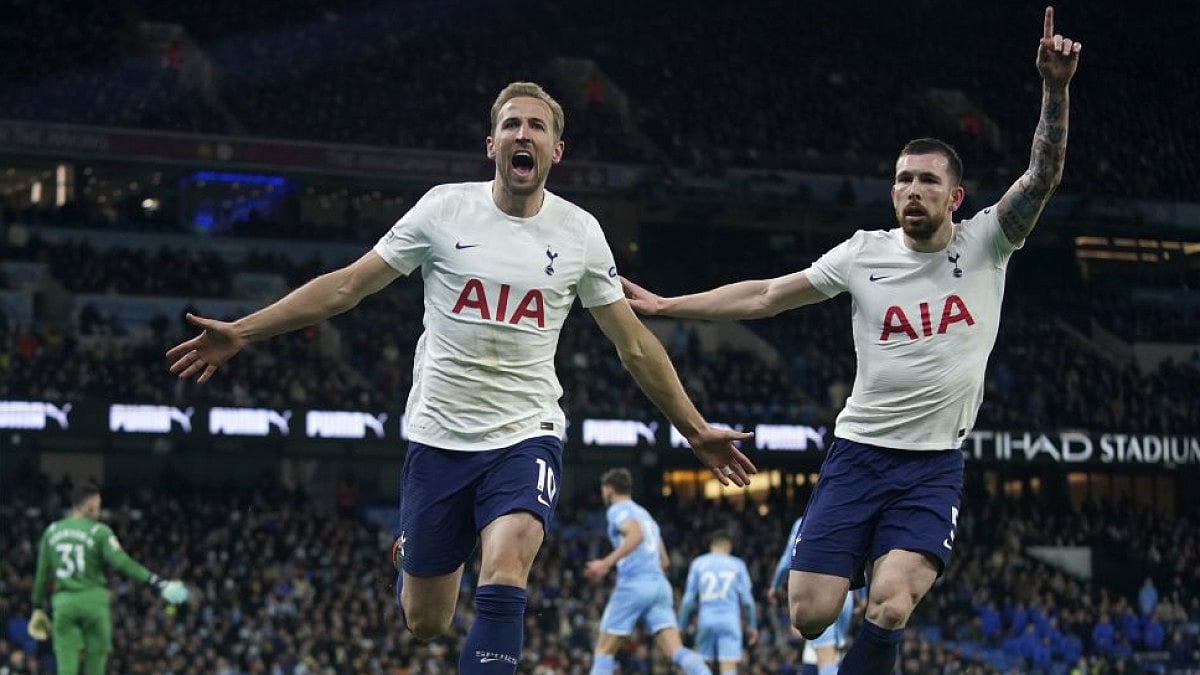 Tottenham's Harry Kane (L) celebrates with Pierre-Emile Hojbjerg after scoring on Feb. 19, 2022.