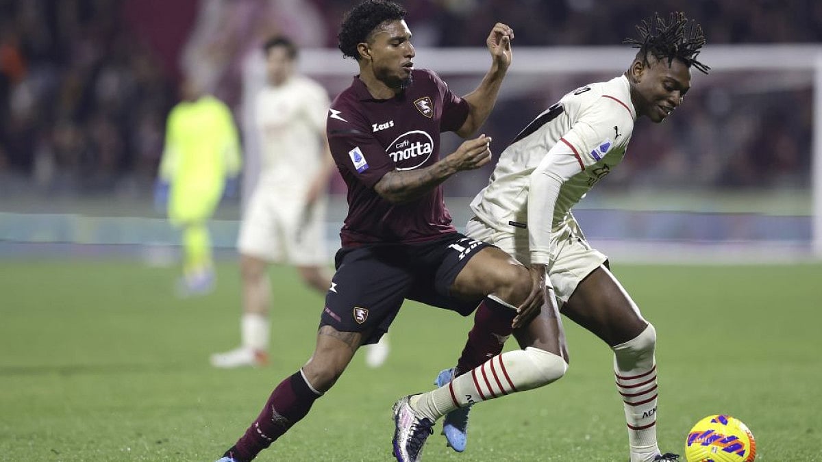AC Milan's Rafael Leao (R) and Salernitana's Ederson fight for the ball in Serie A on Feb. 19, 2022.