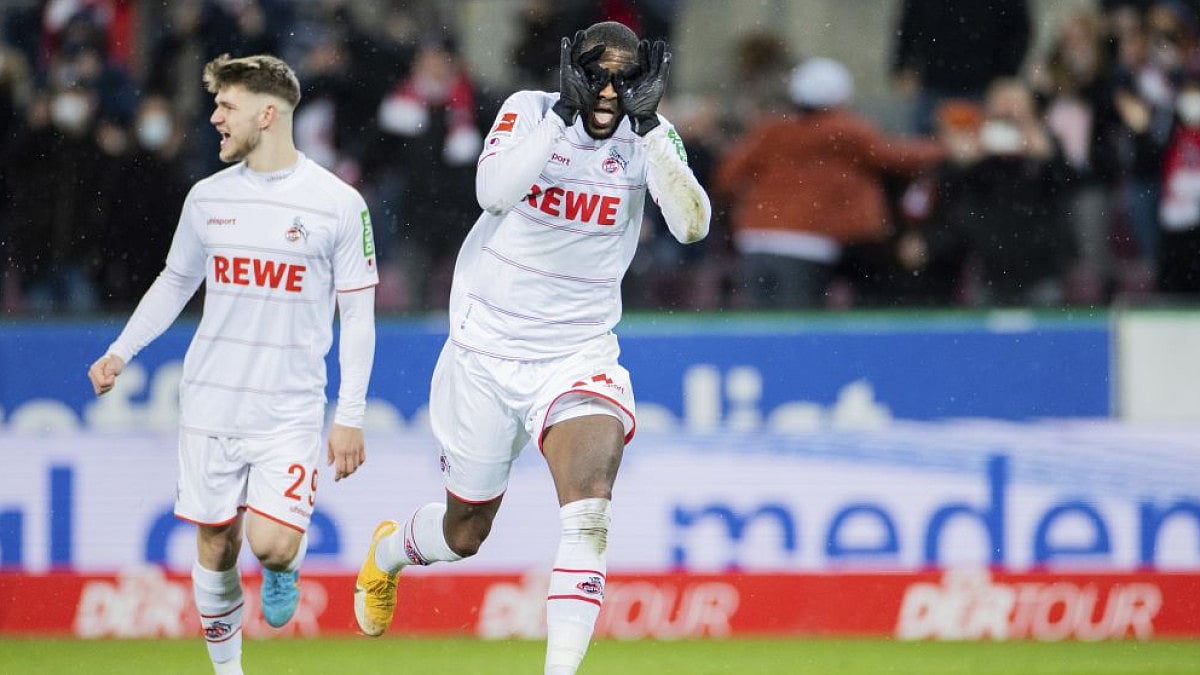 Cologne's Anthony Modeste celebrates scoring during Bundesliga match against Eintracht Frankfurt.