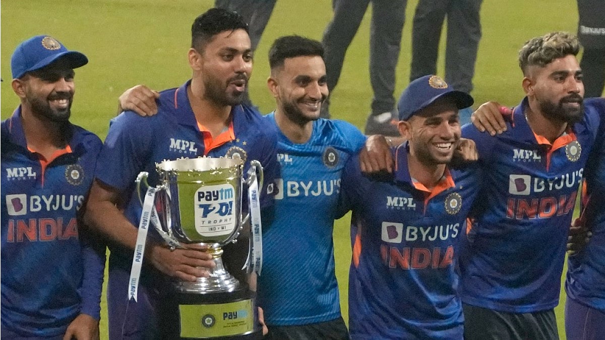 Indian players celebrate with the winners' trophy after defeating West Indies in all T20 series. 