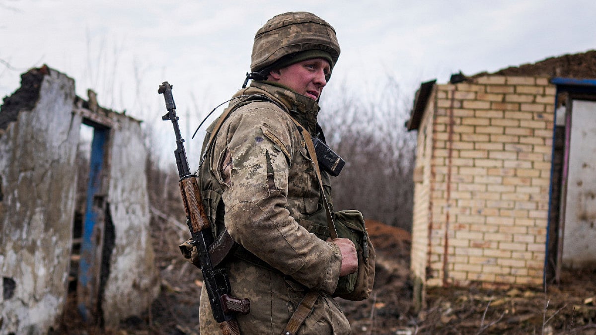 A Ukrainian serviceman stands at his position 