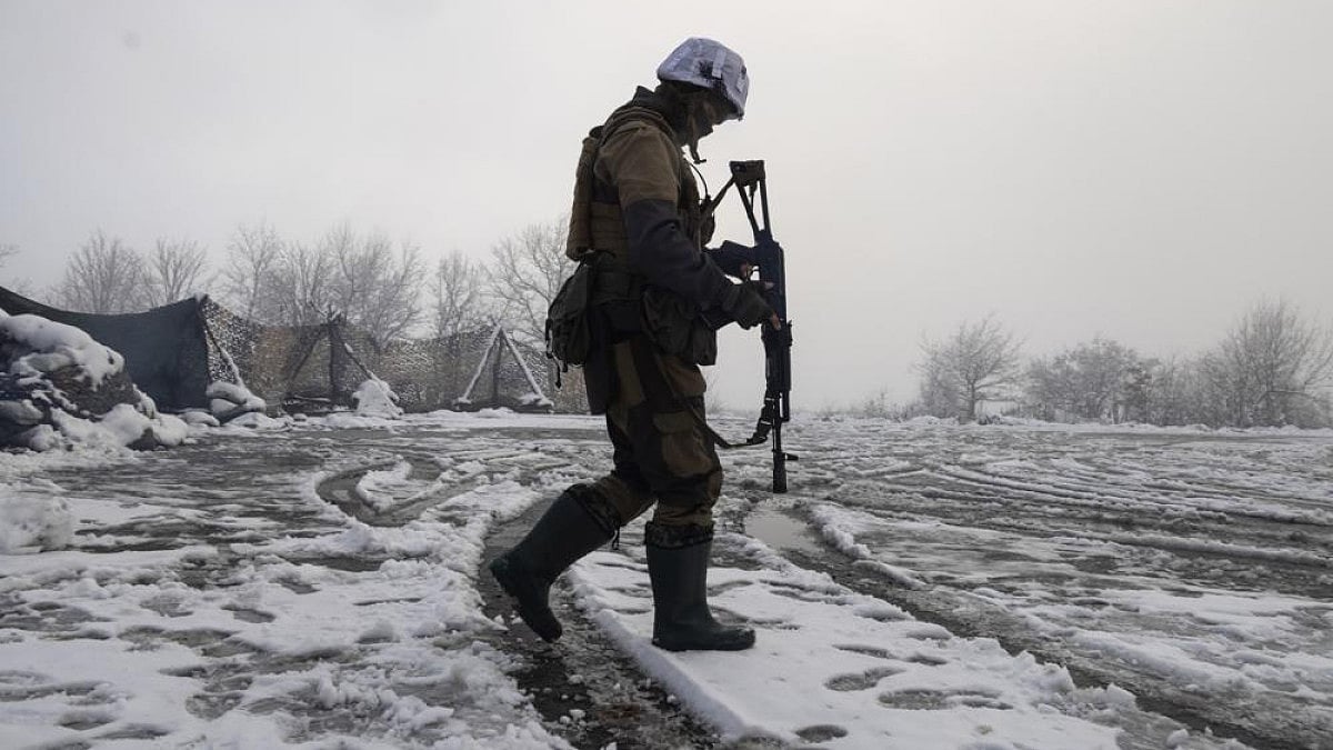 A Ukrainian soldier walks at the line of separation from pro-Russian rebels near Popasna.