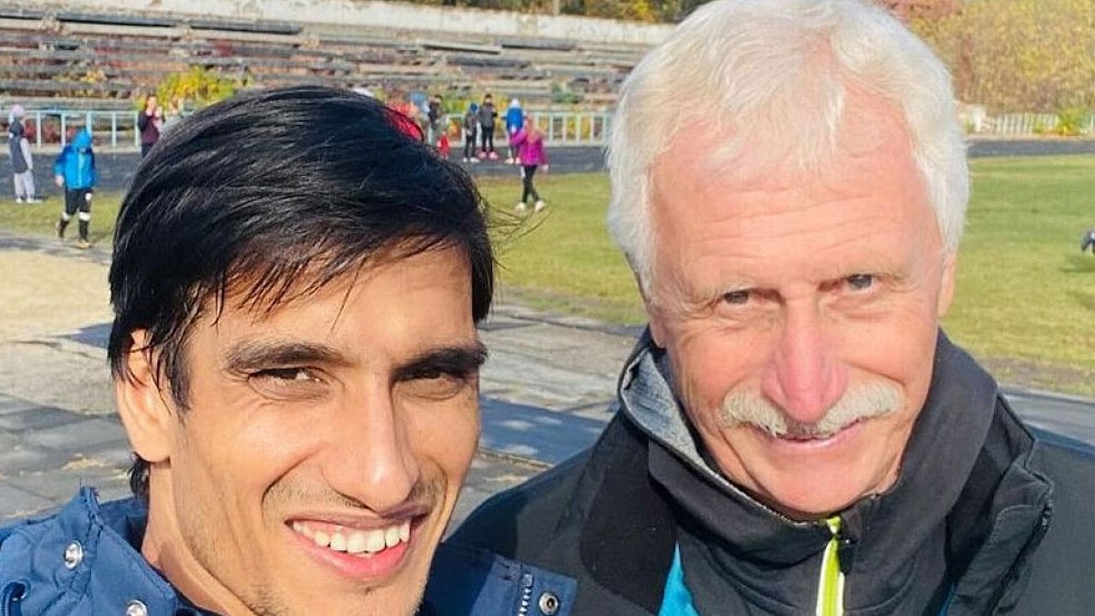 Indian Paralympian Sharad Kumar, left, with his coach Nikitin Yevhen.