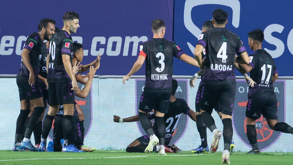Odisha FC players celebrate Redeem Tlang's goal against ATK Mohun Bagan.