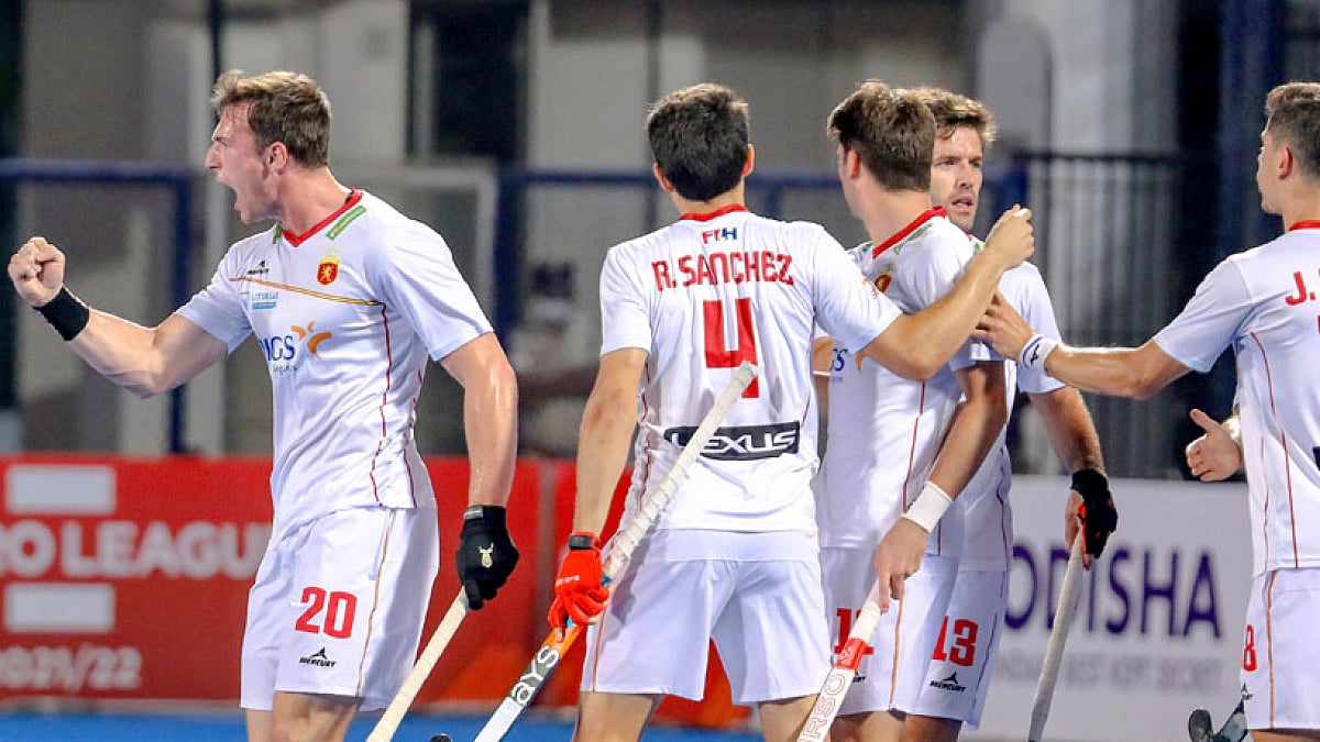 Spain hockey players celebrate a goal against India during their FIH Pro League.